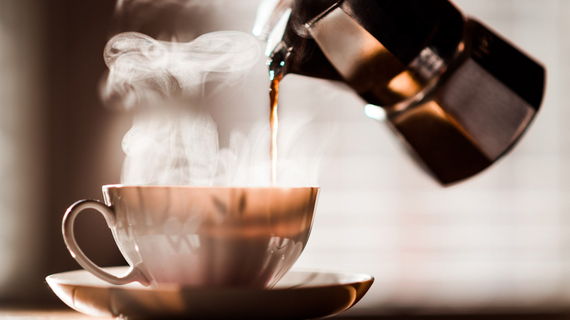 Pouring morning coffee Image - Canva
