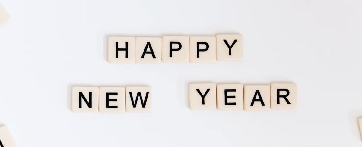 Tiles writing out Happy New Year. Unsplash - Sincerely Media