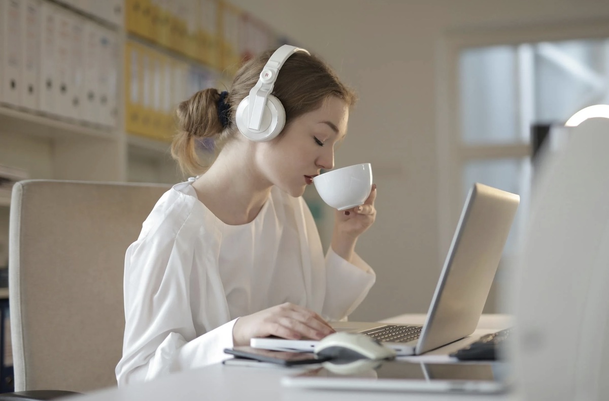Listening to music and drinking coffee while working. Image: Pexels - Andrea Piacquadio