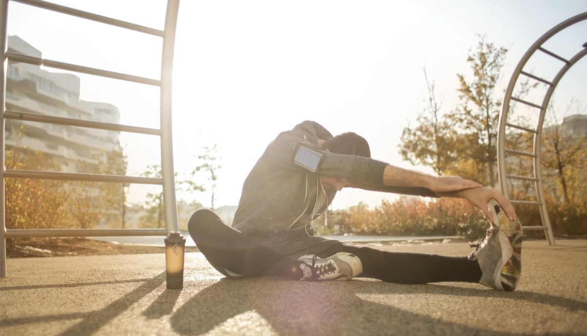Woman stretching. Image: Pexels - Andrea Piacquadio